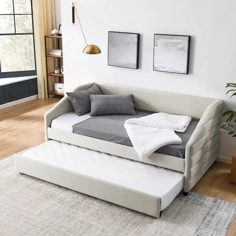 Lit de repos beige à dossier ailé en lin capitonné, avec lit gigogne escamotable