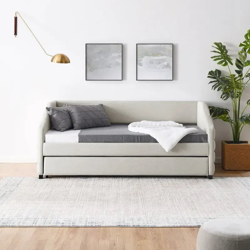 Lit de repos beige à dossier ailé en lin capitonné, avec lit gigogne escamotable