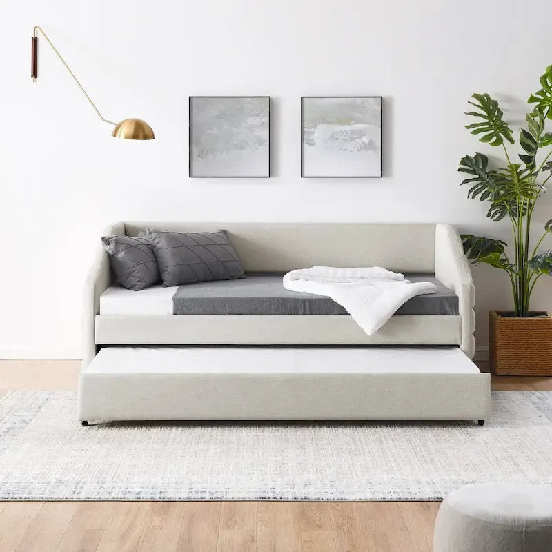 Lit de repos beige à dossier ailé en lin capitonné, avec lit gigogne escamotable